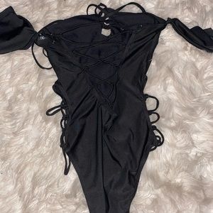 Never worn bathing suit. Size M.